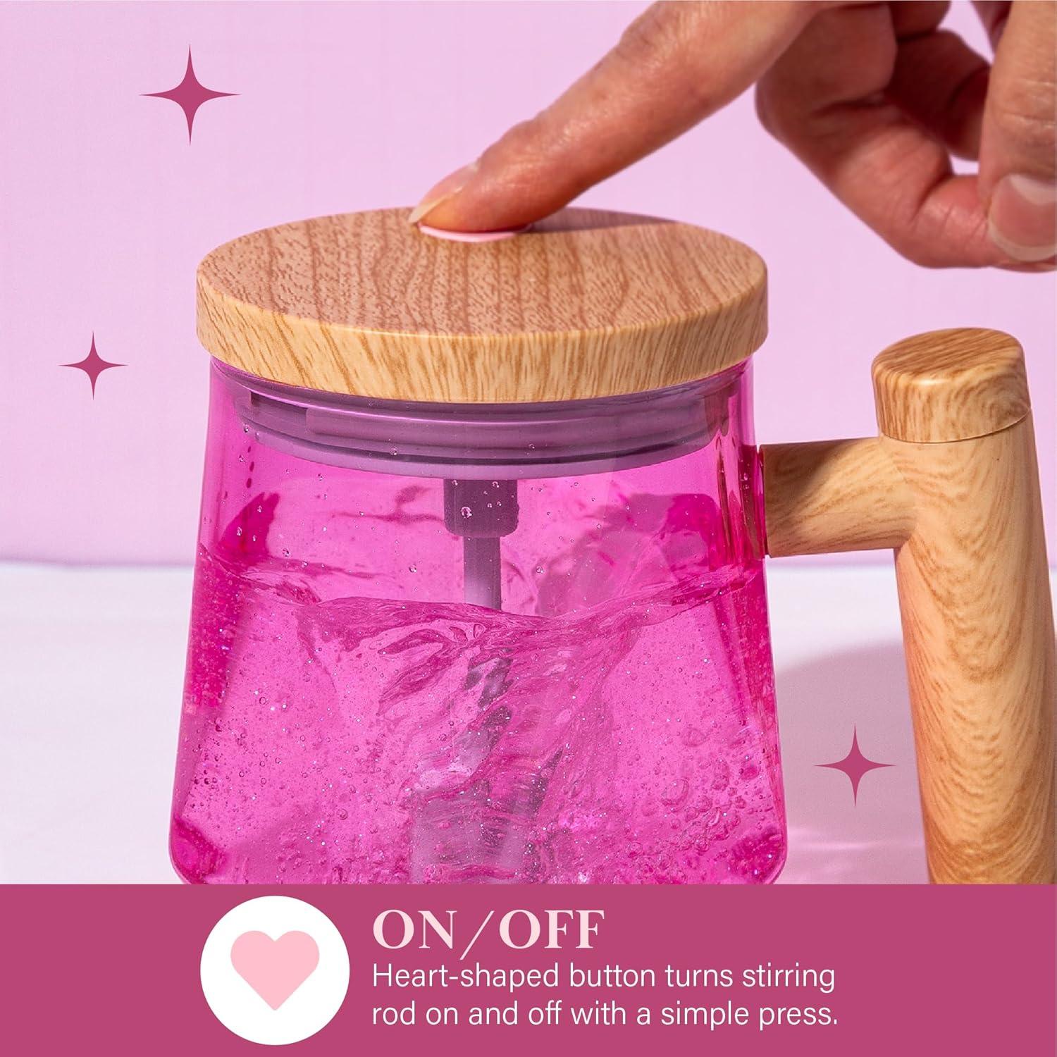 imageParis Hilton Self Stirring Mug BatteryOperated Mixing Mug for Coffee Cocoa Powders and More Durable Borosilicate Glass with Heart Button 135Ounce Size ClearPink